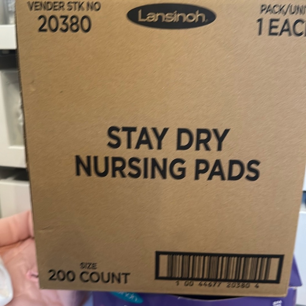 New in box Lansinoh breast pads